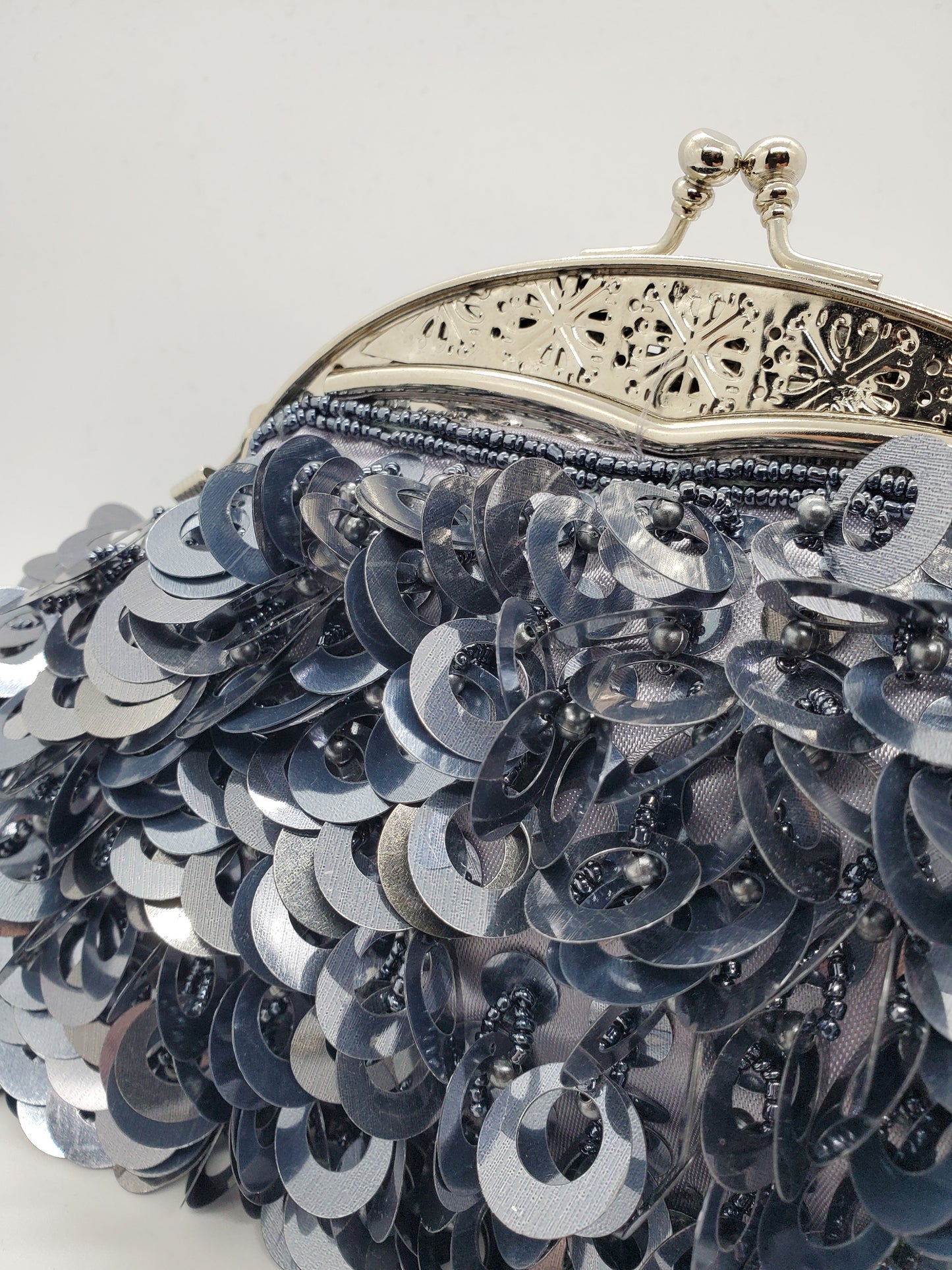 close up view of Large loop paillettes and bead purse