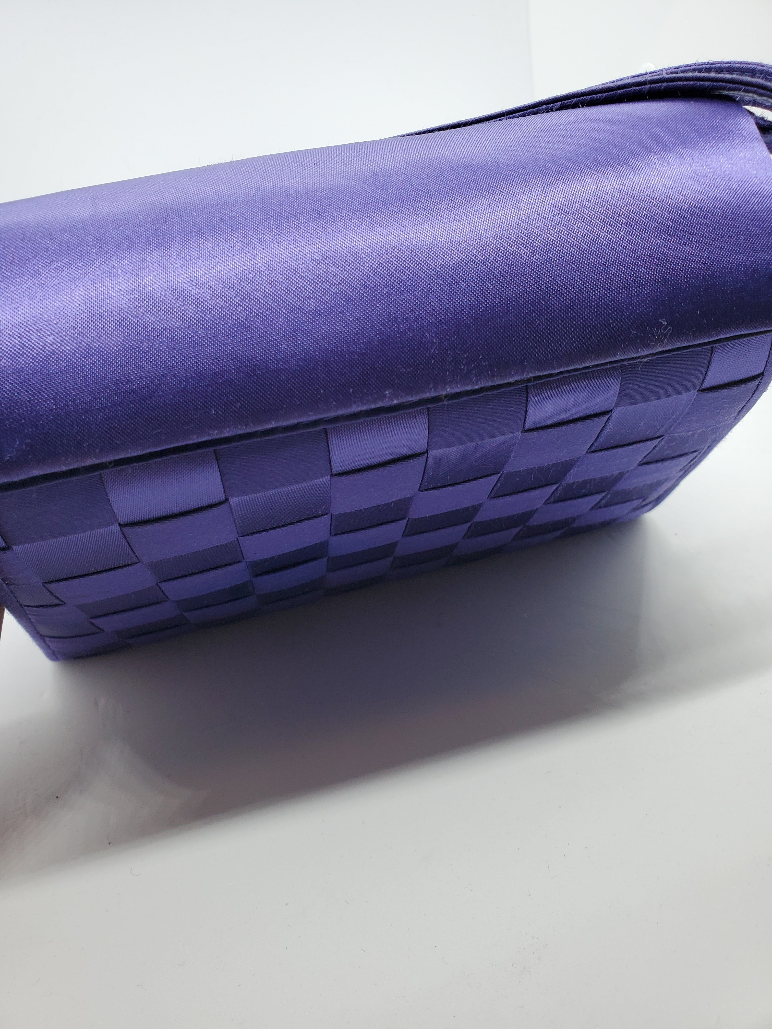 top view of purple handbag with woven details