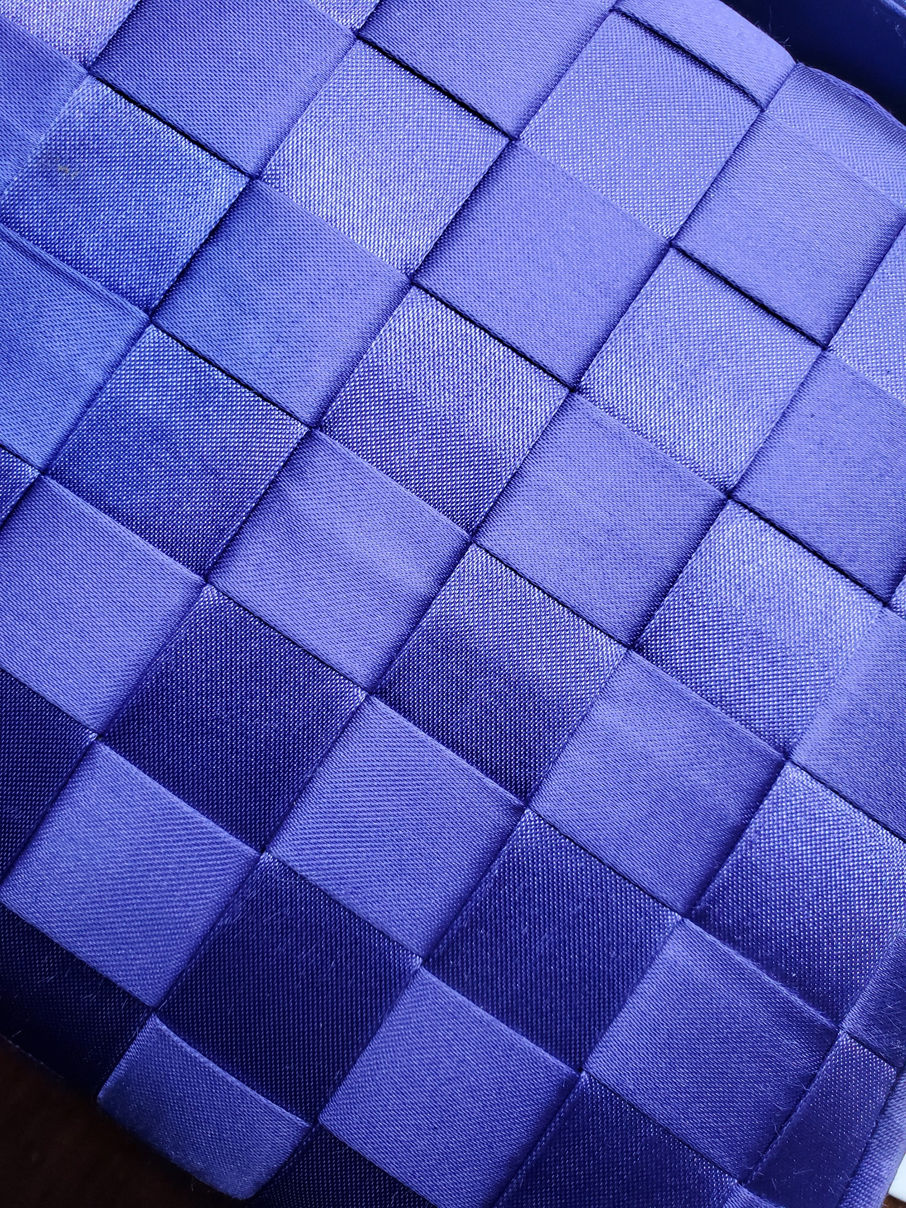 view of purple handbag woven details