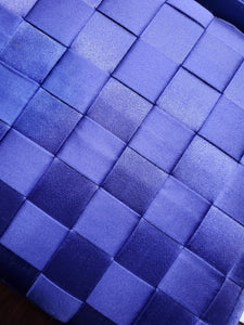 view of purple handbag woven details