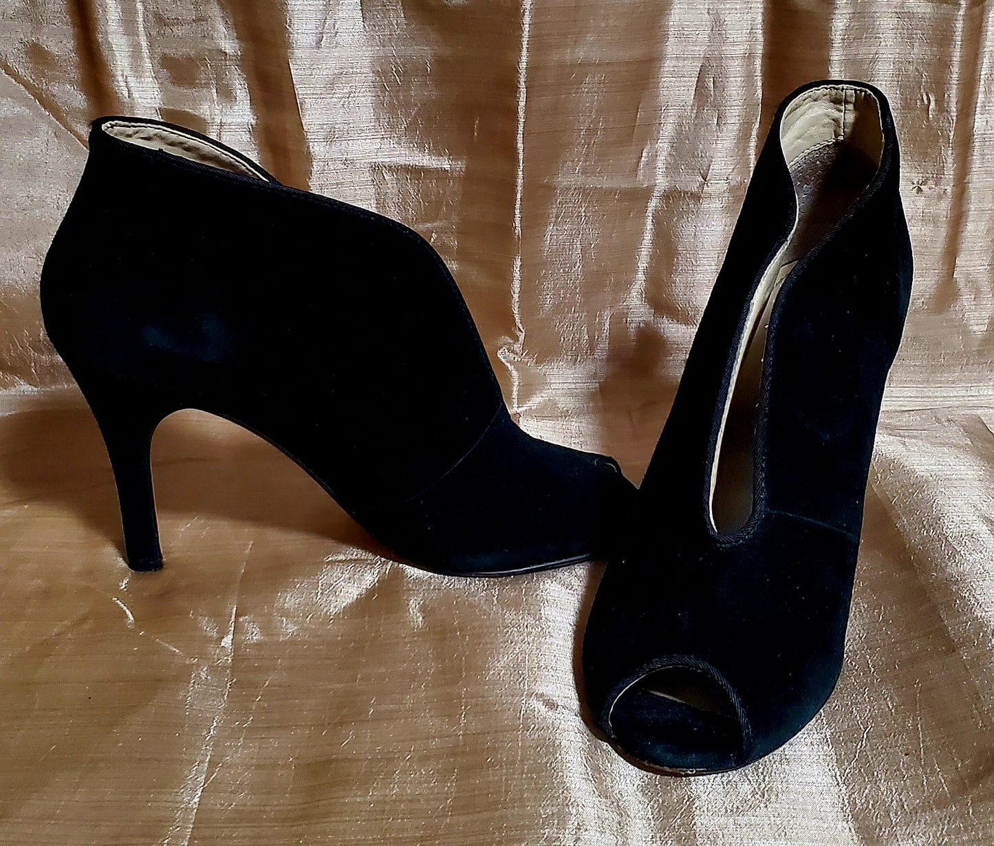 front and side view of Adrienne Vittadini black Open toe, high top high heel shoes on gold background