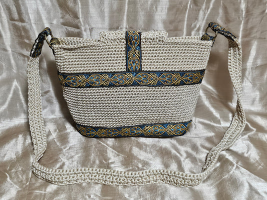 Back view of Cream coloured crochet handbag with Teal and Gold paisley trim
