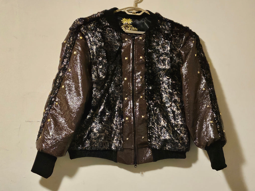 front view of Faux fur and patent leather bomber jacket with stud details