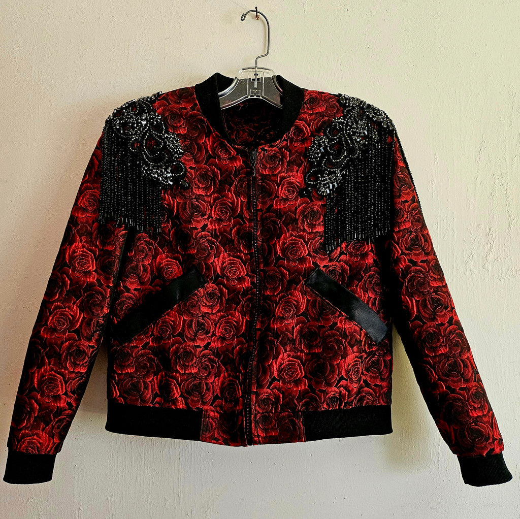 Front View of Red rose brocade bomber jacket with rhinestone appliqued shoulders with beaded fringe.