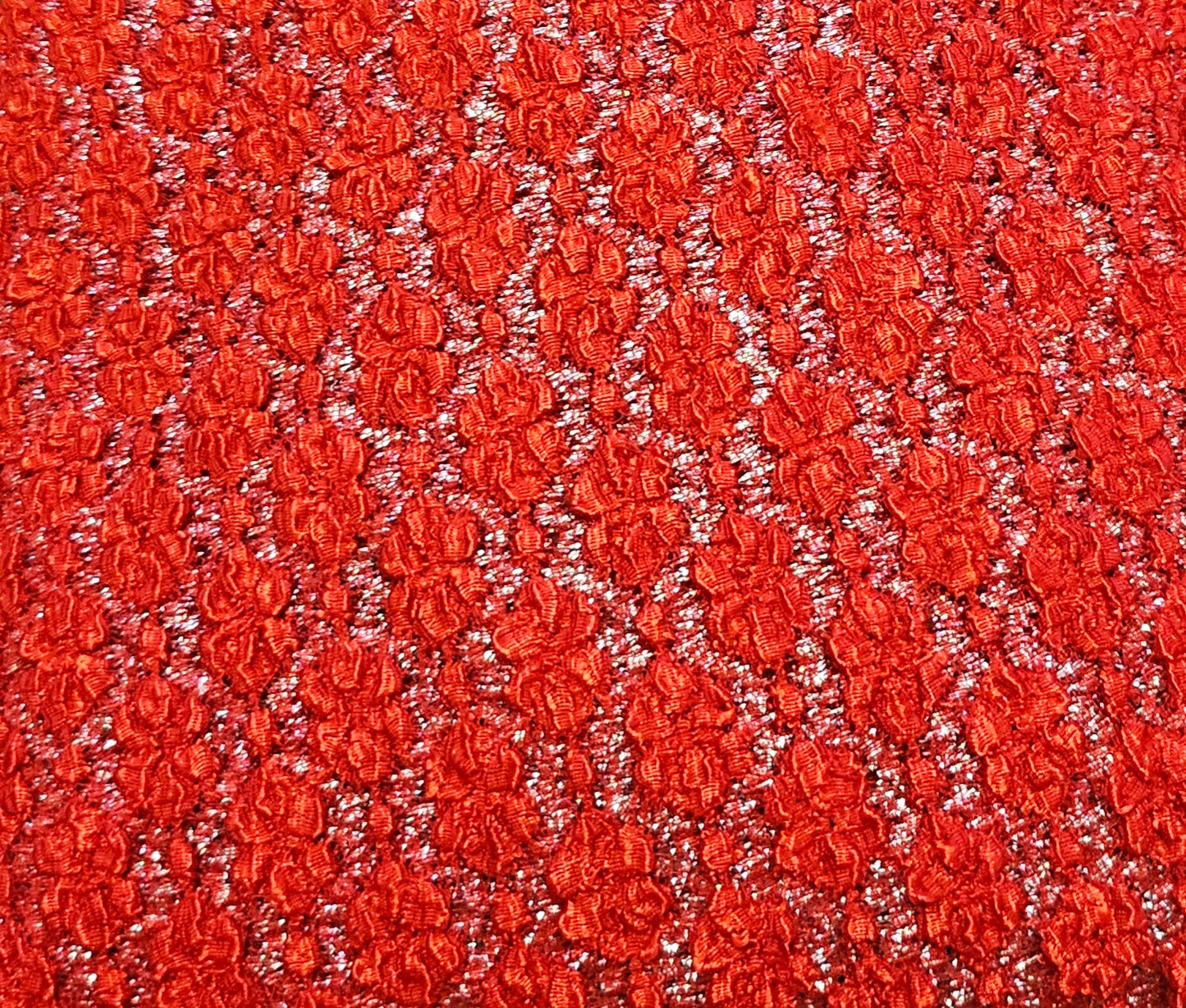 close up view of the fabric of Red and Silver Crochet Dress