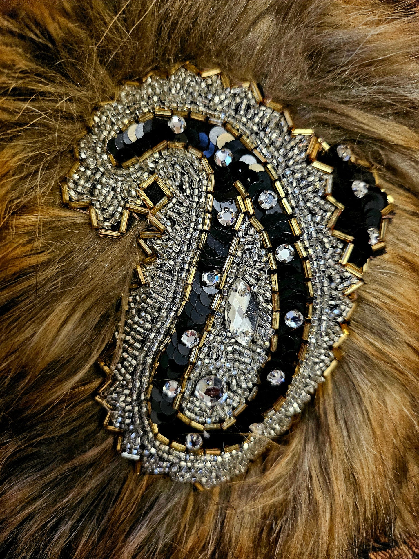 close up of beading on fur stole on Art Deco-inspired beaded gown with detachable faux fur stole and appliques