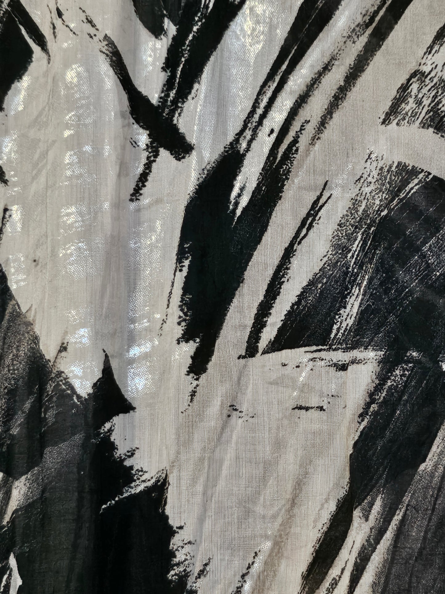 Fabric view of Sheer abstract printed bomber jacket with bowtie detail