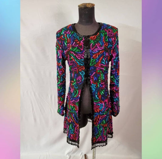 front view of Rainbow sequined jacket dress with fringe details on mannequin