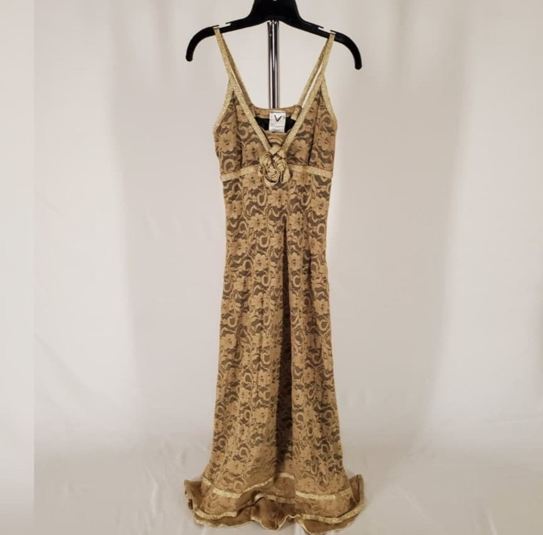 Front view of Lace Cocktail Dress with golden trim rose detail hanging on rack