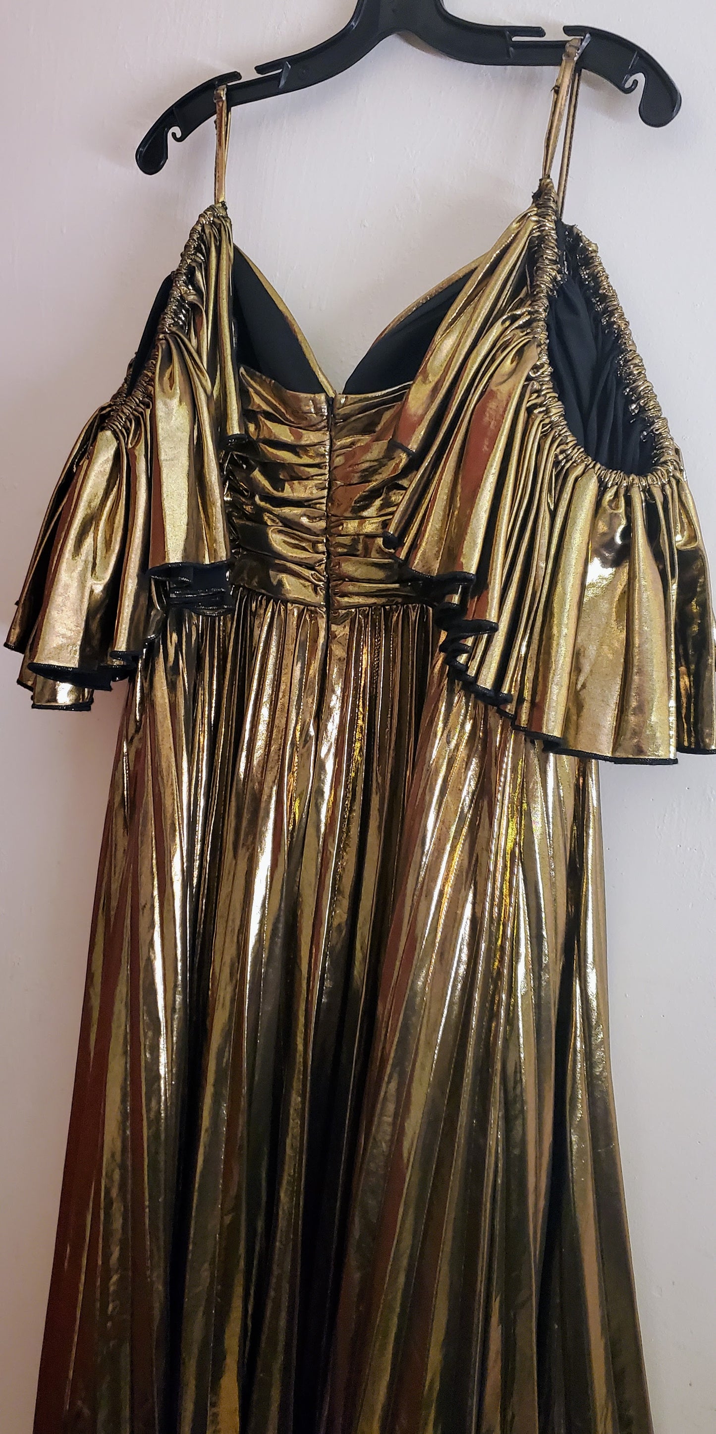 Back view of a gold ruffled dress