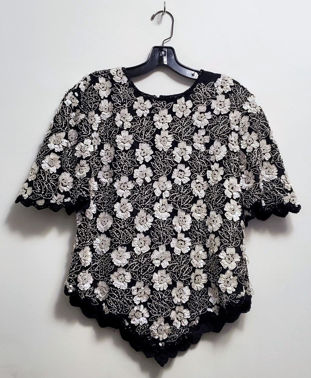 Front view of Vintage 80s Black and White Beaded Floral Top