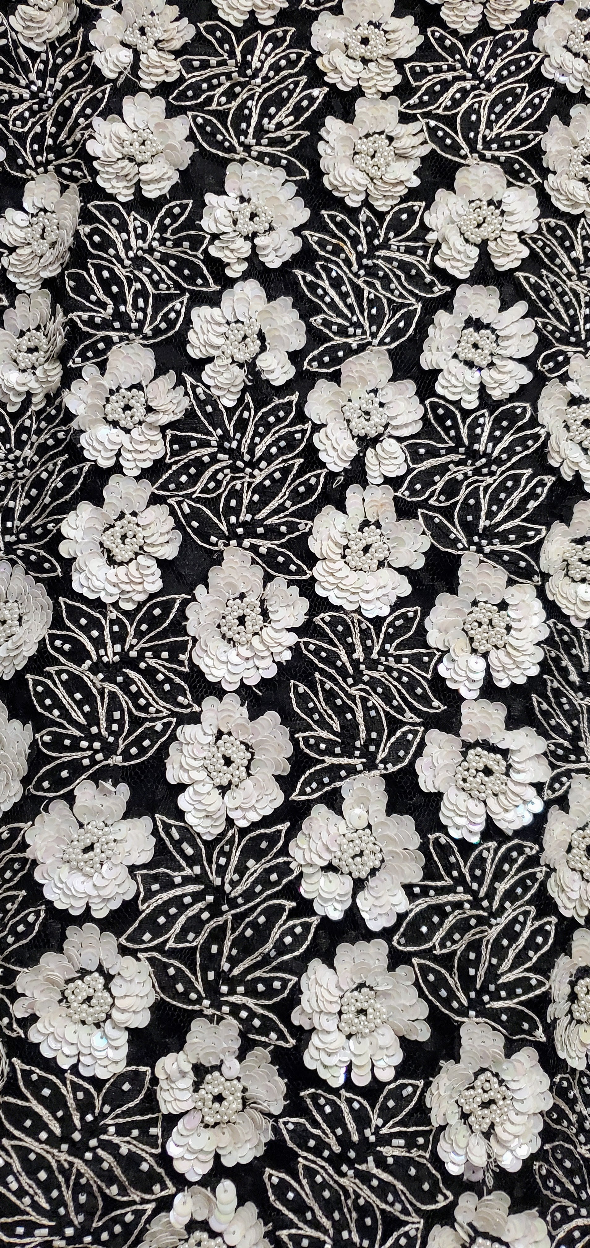 Close up view of the beading and sequins of Vintage 80s Black and White Beaded Floral Top