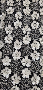 Close up view of the beading and sequins of Vintage 80s Black and White Beaded Floral Top