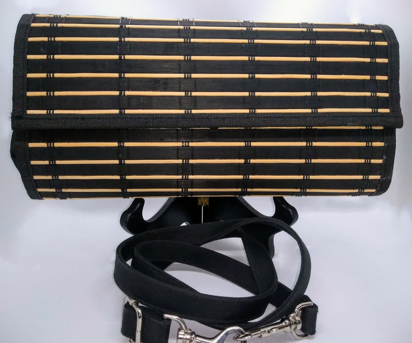 Black clutch and crossbody strap.