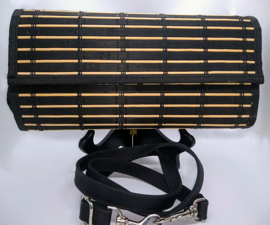 Black clutch and crossbody strap.