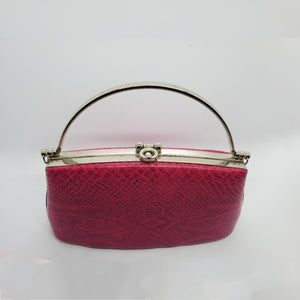 top view of hot pink snakeskin print handbag