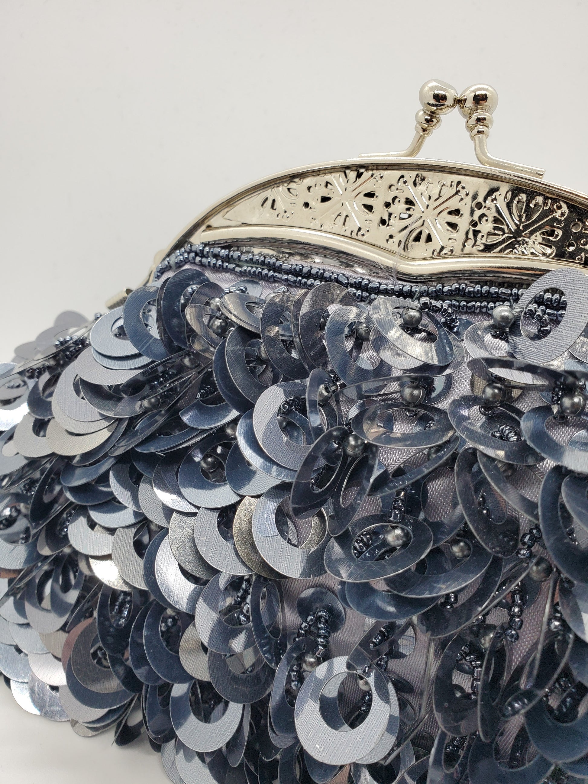 close up view of  Large loop paillettes and bead purse 
