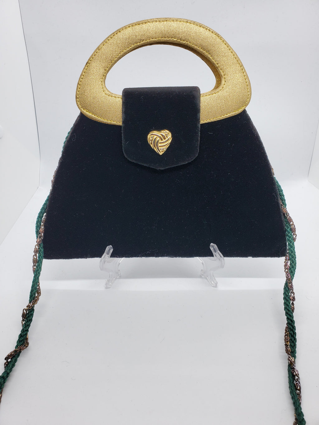 front view of green and gold velvet handbag with heart detail