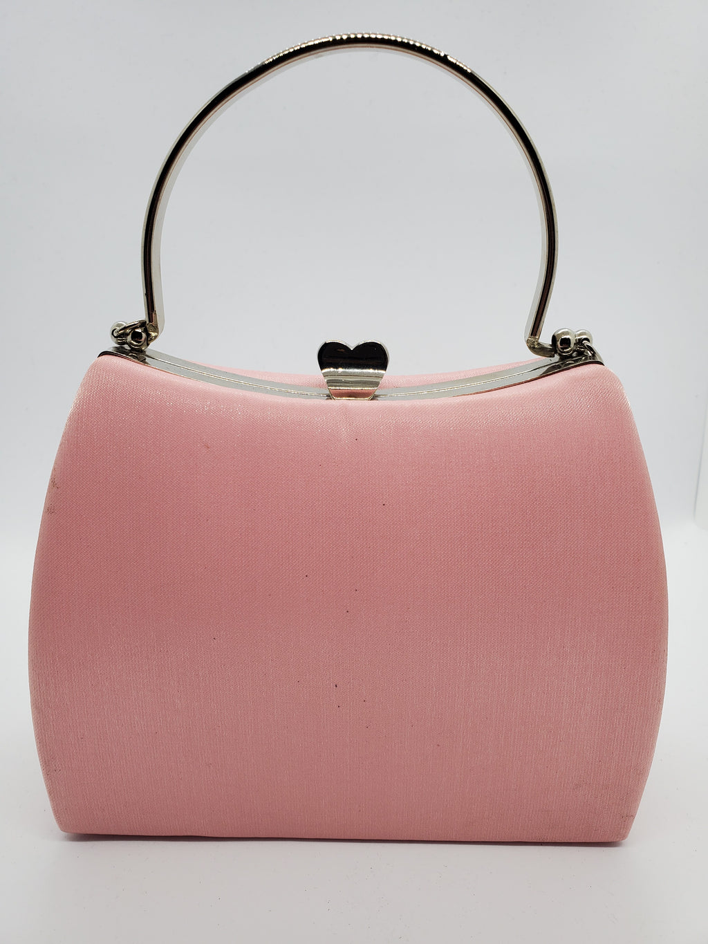 Front View of Light pink satin hard shell purse