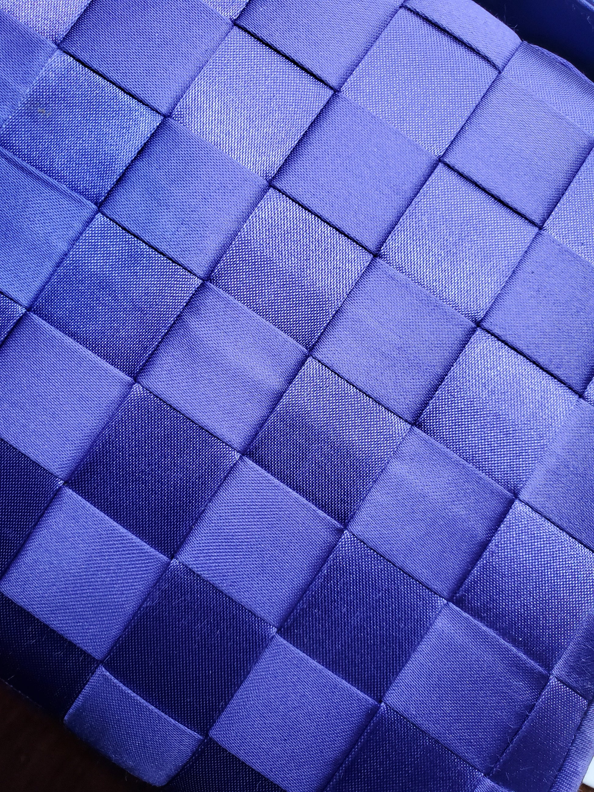 view of purple handbag woven details