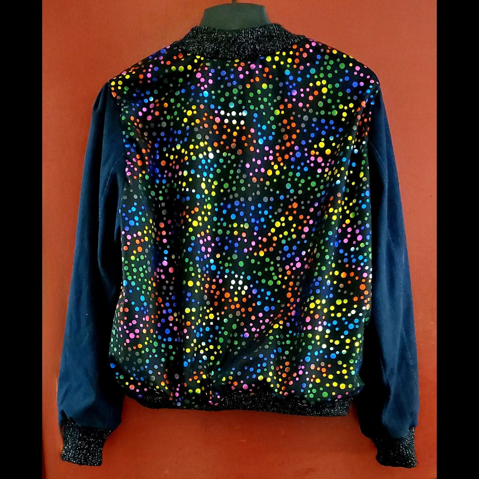 Back view of Multi-coloured polka dot and denim bomber jacket
