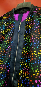 Front zipper view of Multi-coloured polka dot and denim bomber jacket