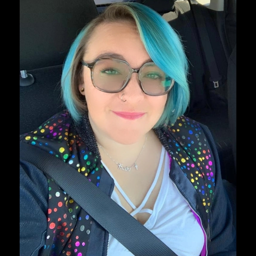 Multi-coloured polka dot and denim bomber jacket on model