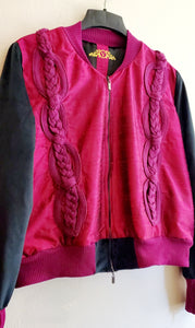 close up front view of Cable knit and raw silk jacket with velveteen sleeves