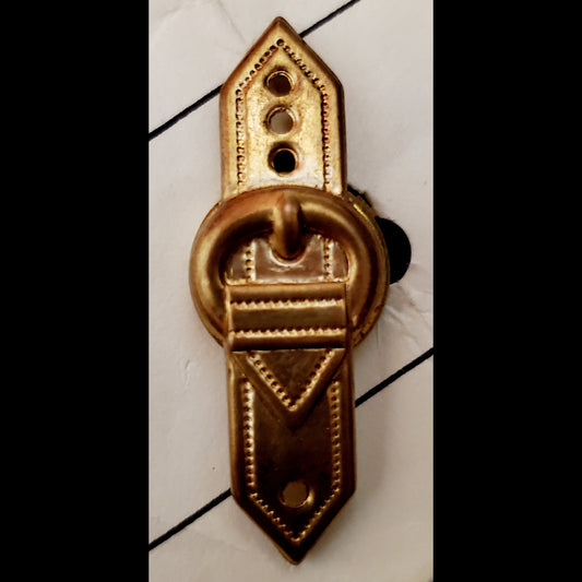 Close up view of belt buckle button cover