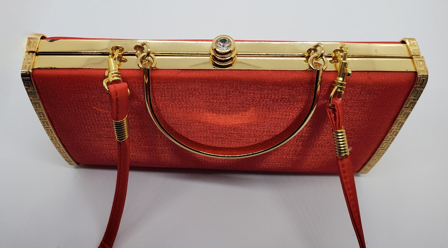 Top view of Red and gold vintage hard shell bag