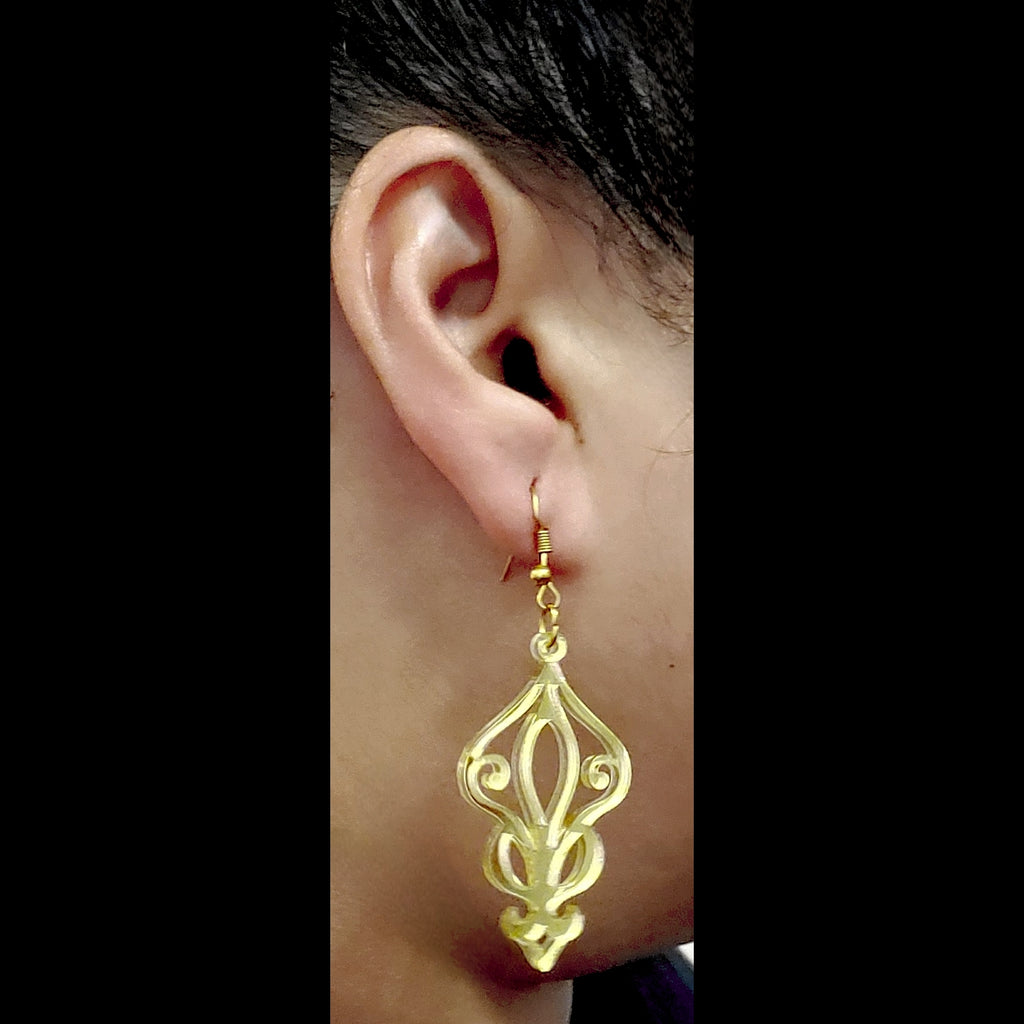 Model wearing gold Acrylic Baroque style earrings