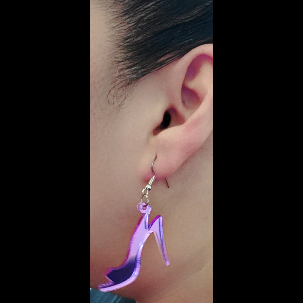 Pink acrylic shoe earring on model