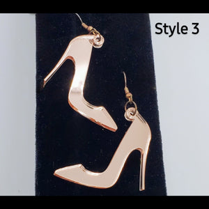 Rose gold stilettos acrylic shoe earrings on stand