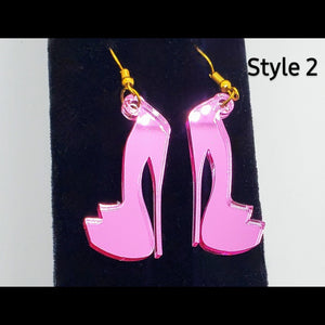 Metallic pink platform heel acrylic shoe earrings on stand