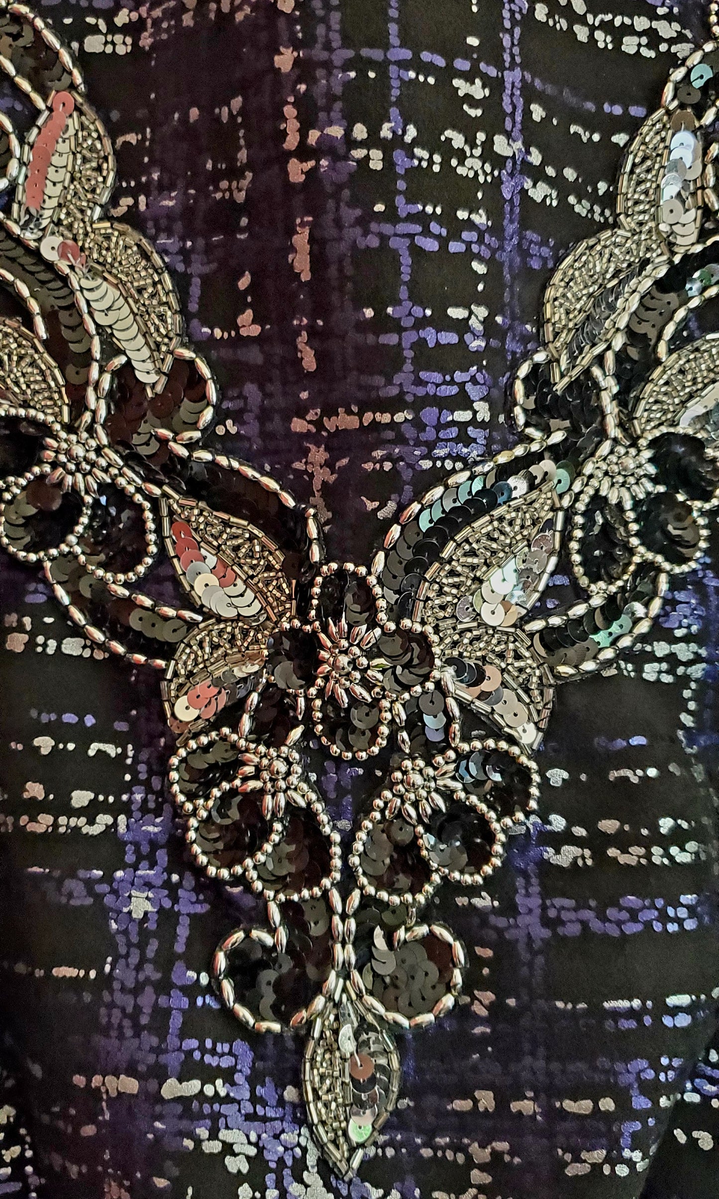Close up of Sequin and bead applique on Front view of Purple and Silver plaid bomber jacket