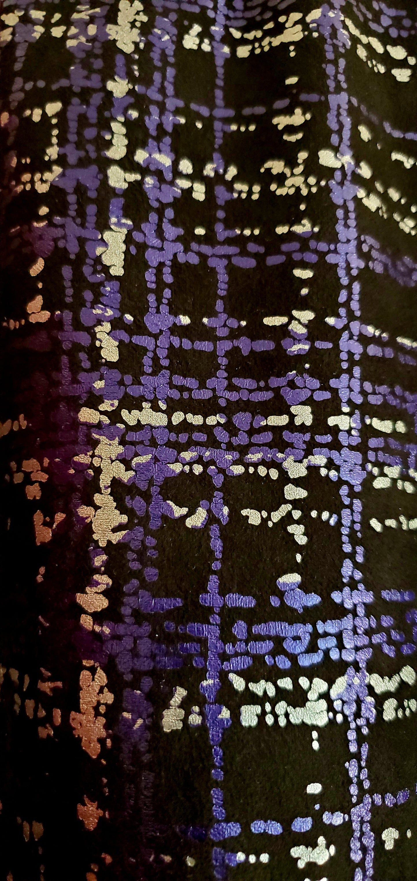 Close up view of the fabric  of Purple and Silver plaid bomber jacket with extravagant beaded sequin applique detail