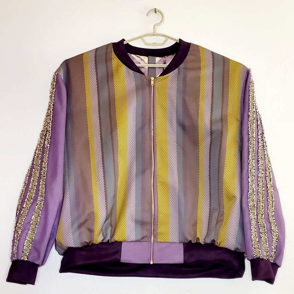 Front view of Purple striped jacquard bomber jacket with racing striped sleeves