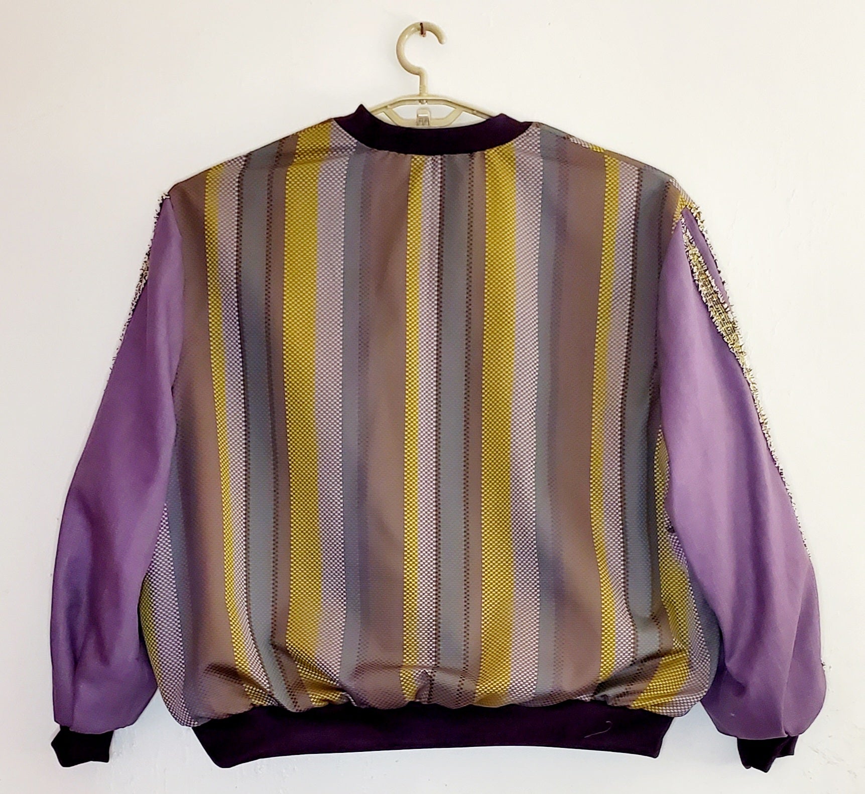 Back view of Purple striped jacquard bomber jacket with racing striped sleeves
