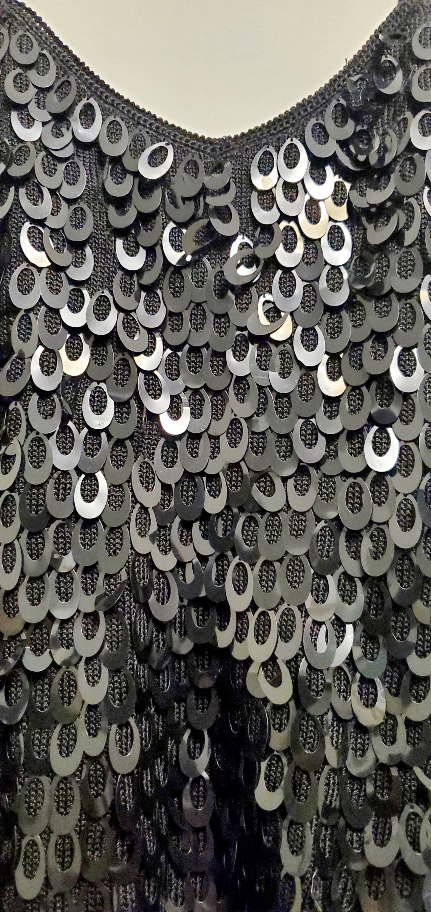 Close up front view of Black knitted paillettes tank top