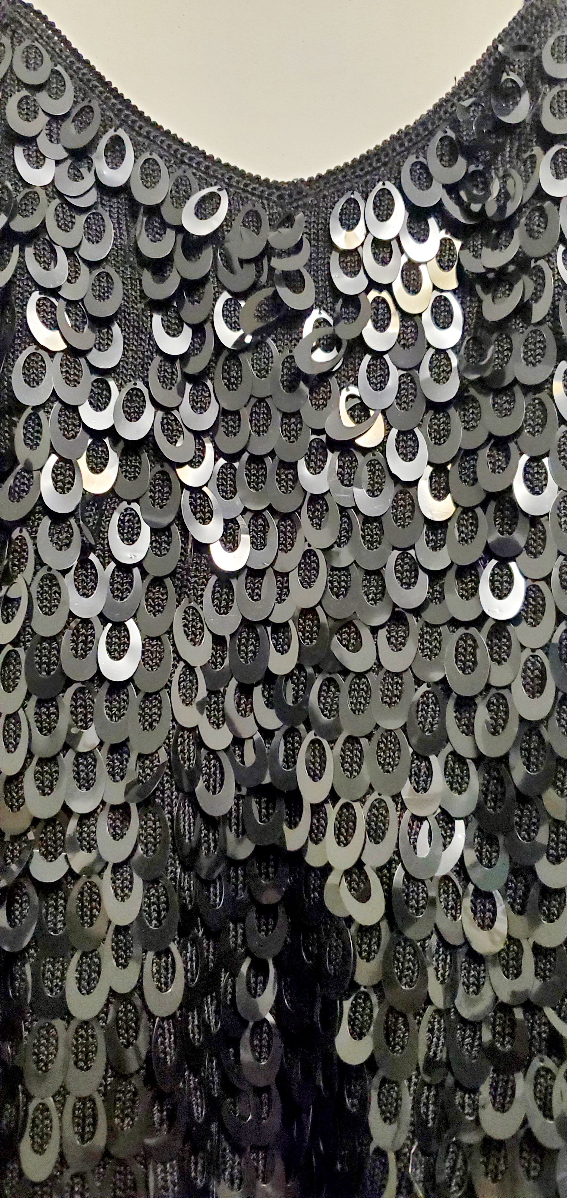 Close up front view of Black knitted paillettes tank top