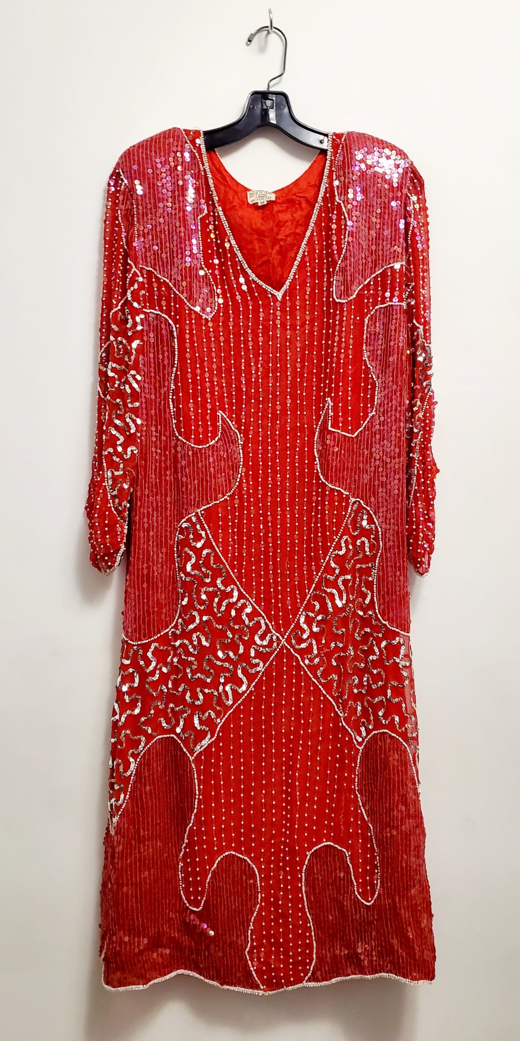 Front view of vintage red and silver sequin dress