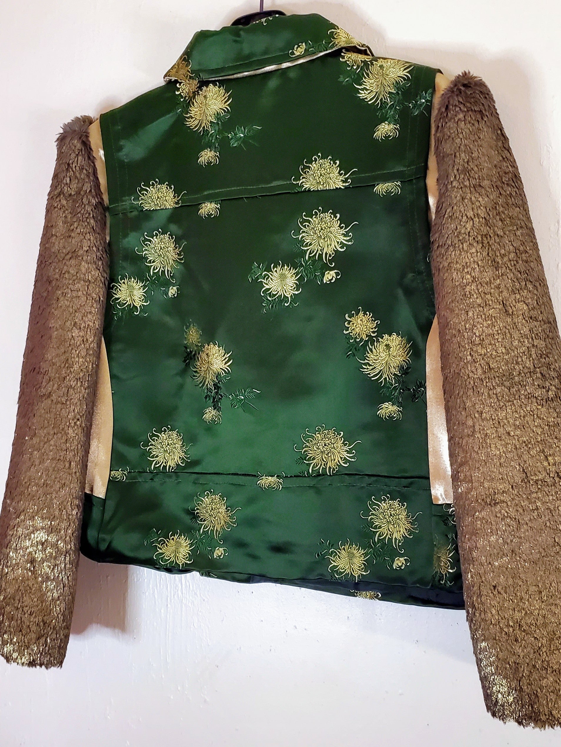 Close up back view Floral Green Silk moto jacket with bronze fur sleeves