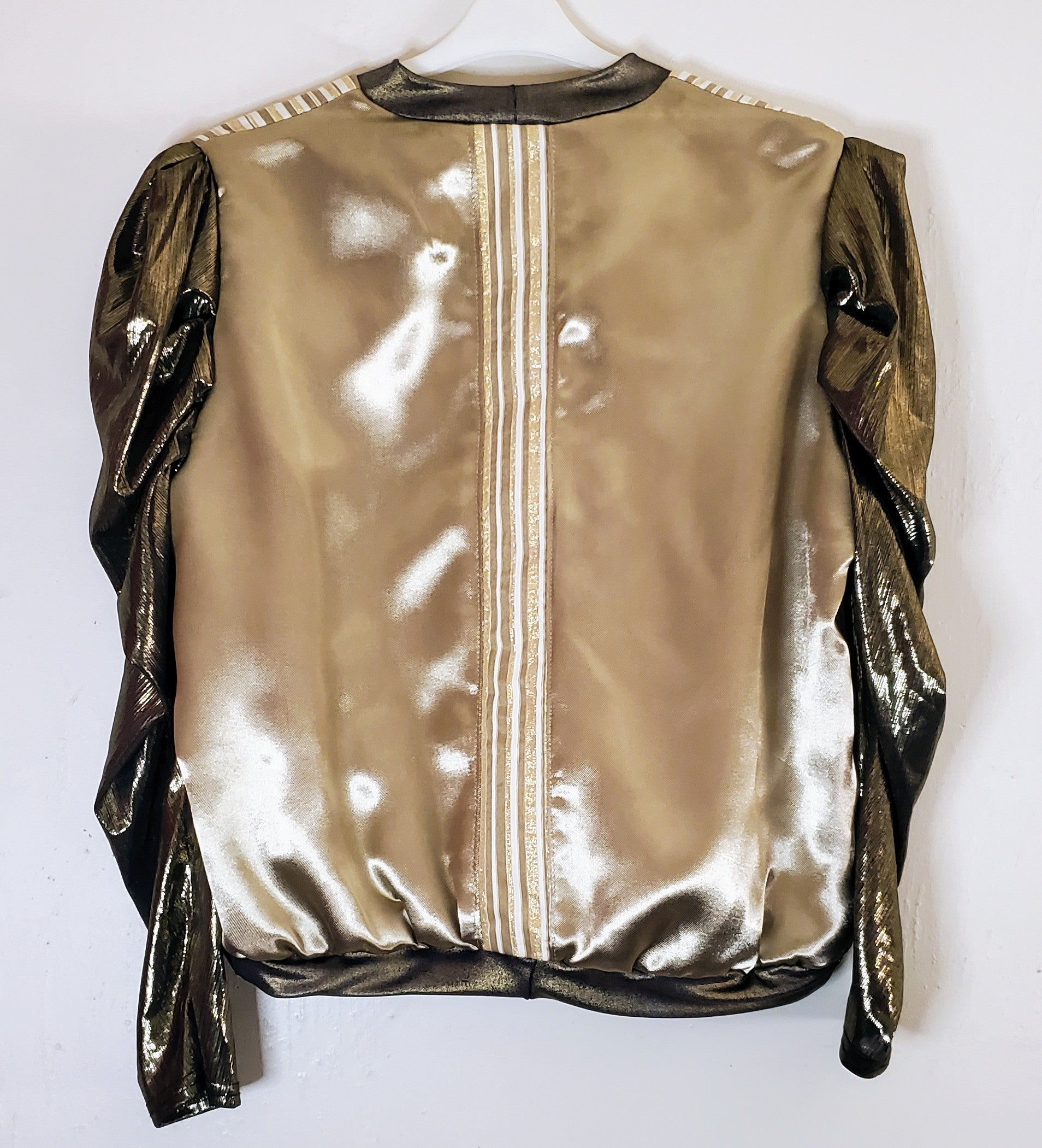 Back view of Gold and ivory striped bomber jacket with gigot sleeves