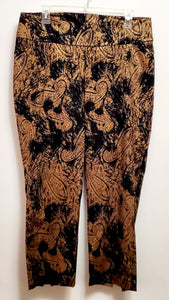 Front view of cropped pants of 2 piece black and gold paisley suit with lace wing epaulettes