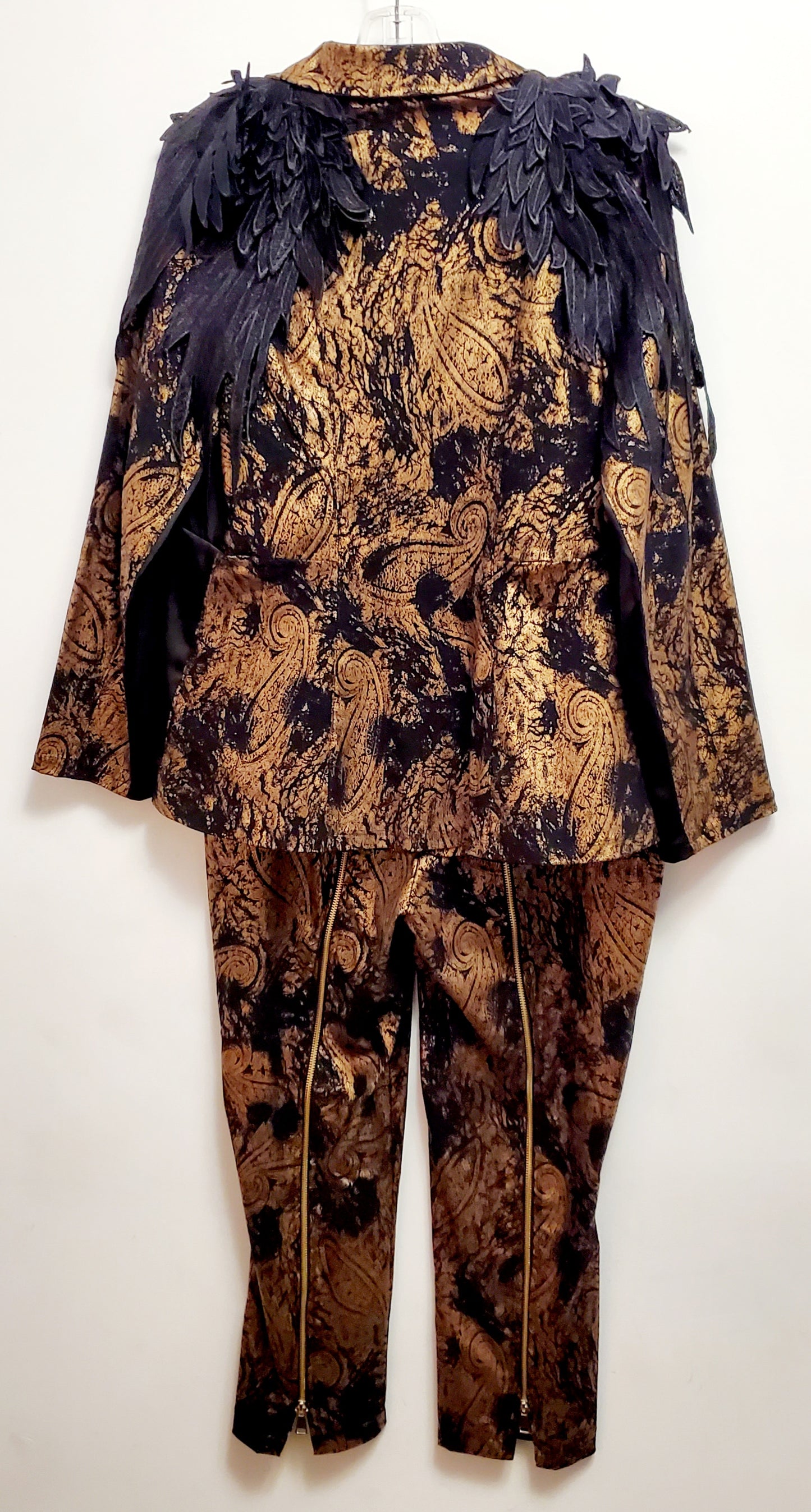 Back view of 2 piece black and gold paisley suit with lace wing epaulettes