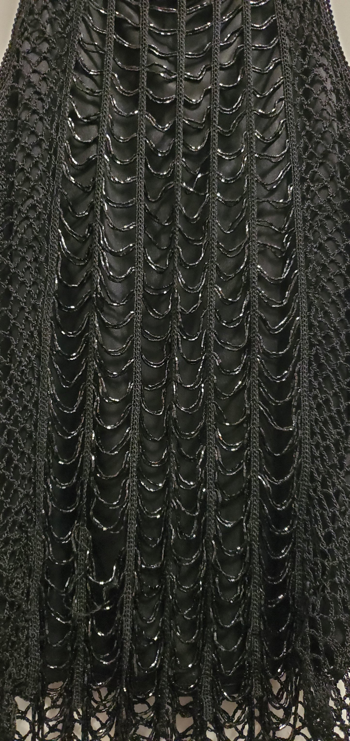 close up of beaded front of 90s black crochet beaded top