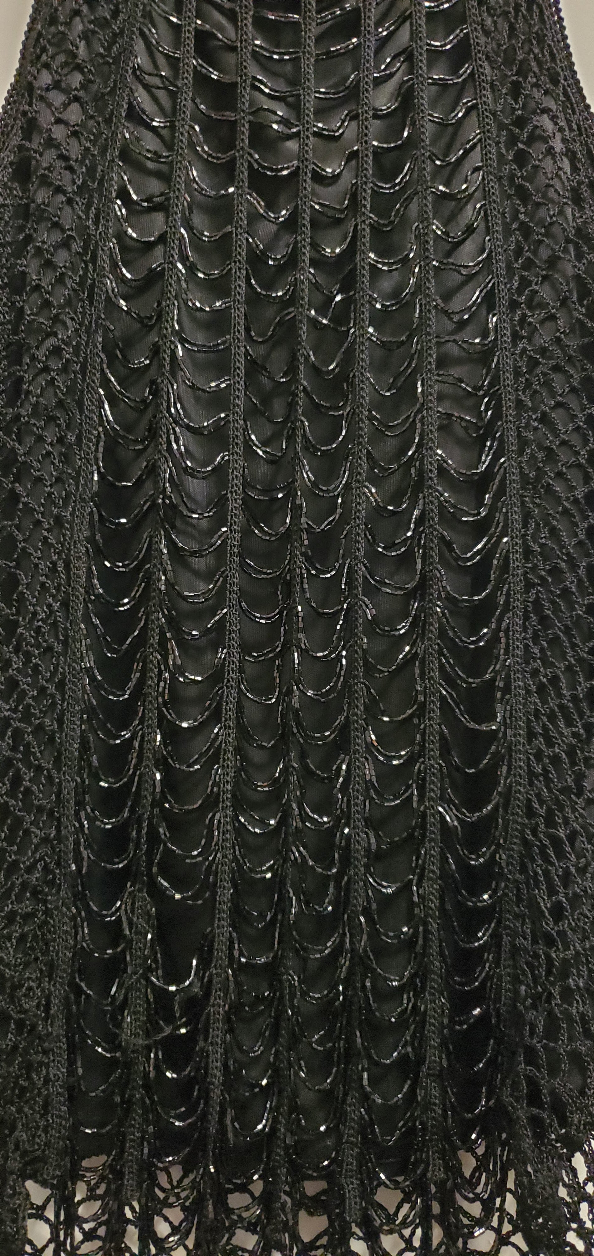 close up of beaded front of 90s black crochet beaded top