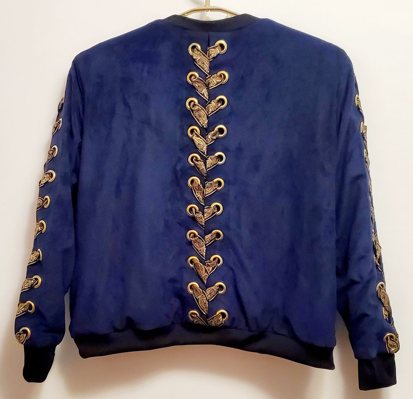 REIGN-Navy blue bomber jacket with hook and eye front and laced sleeves and back