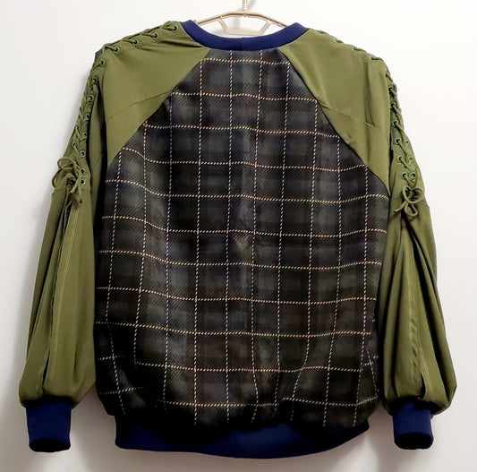 back view of Forest green plaid bomber jacket with split sleeves and laced shoulder details.