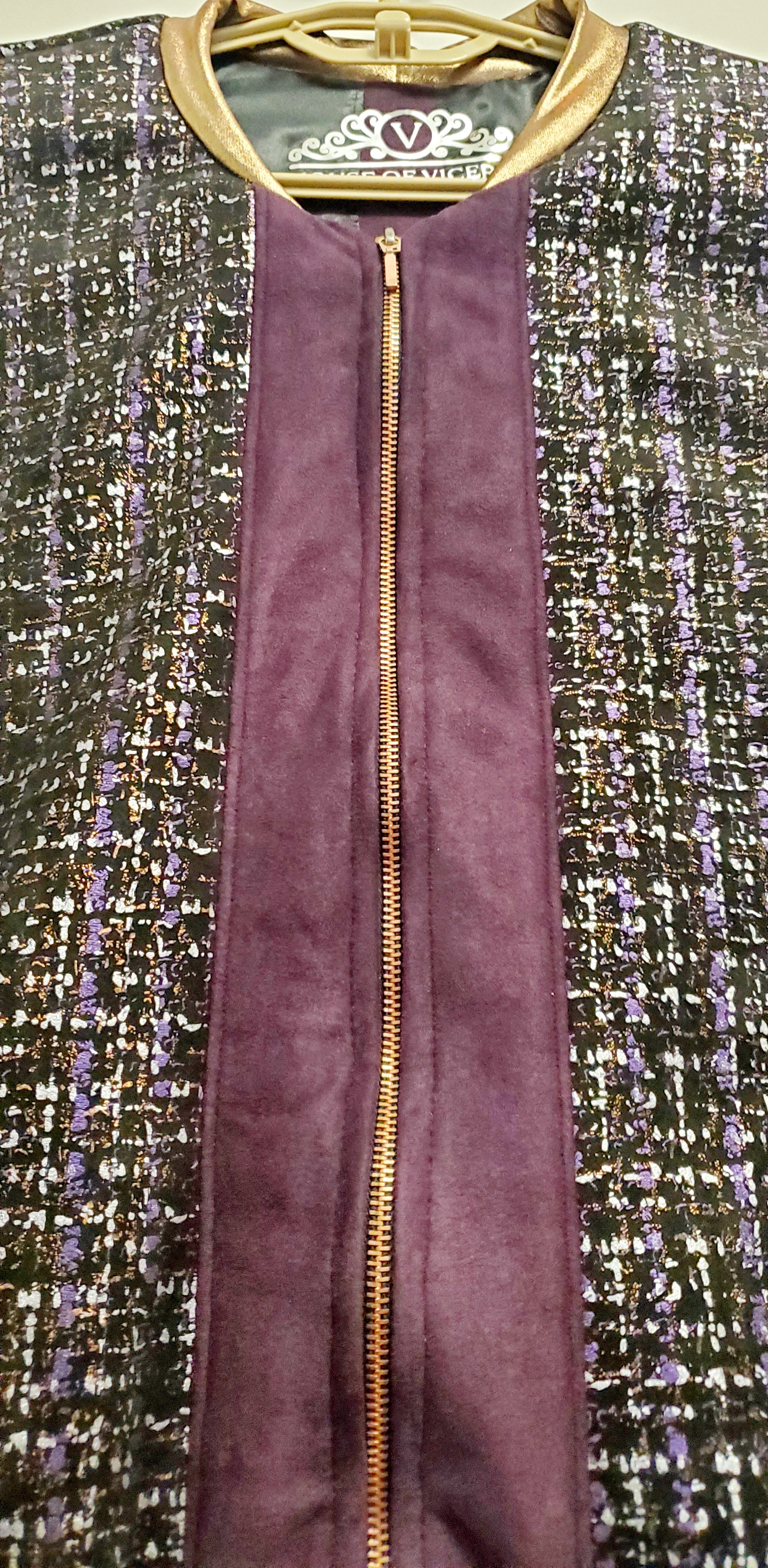 Zipper view of Purple, silver, and copper tweed printed bomber jacket